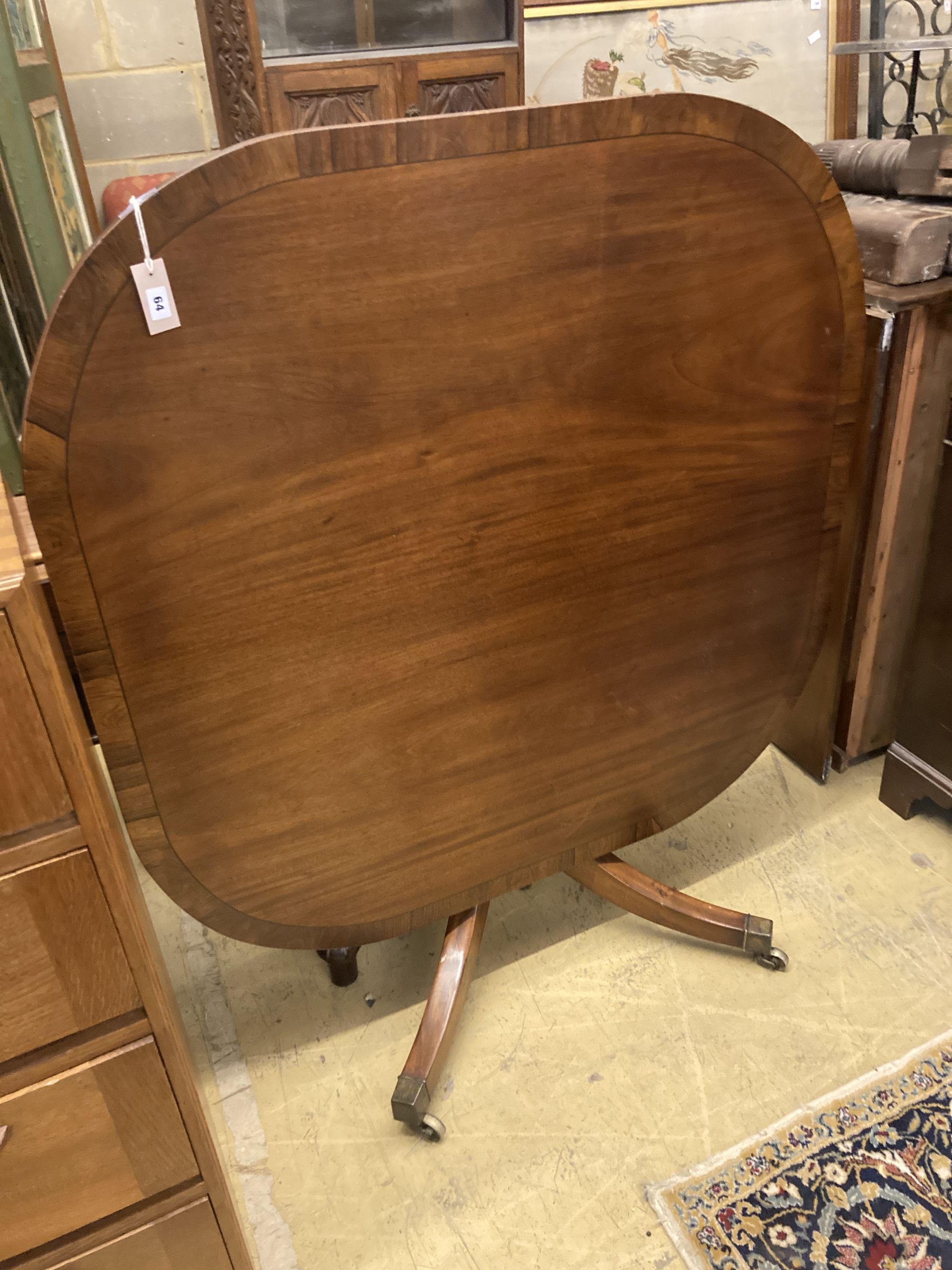 A George IV rosewood banded mahogany tilt top breakfast table, width 117cm, depth 117cm, height 69cm
